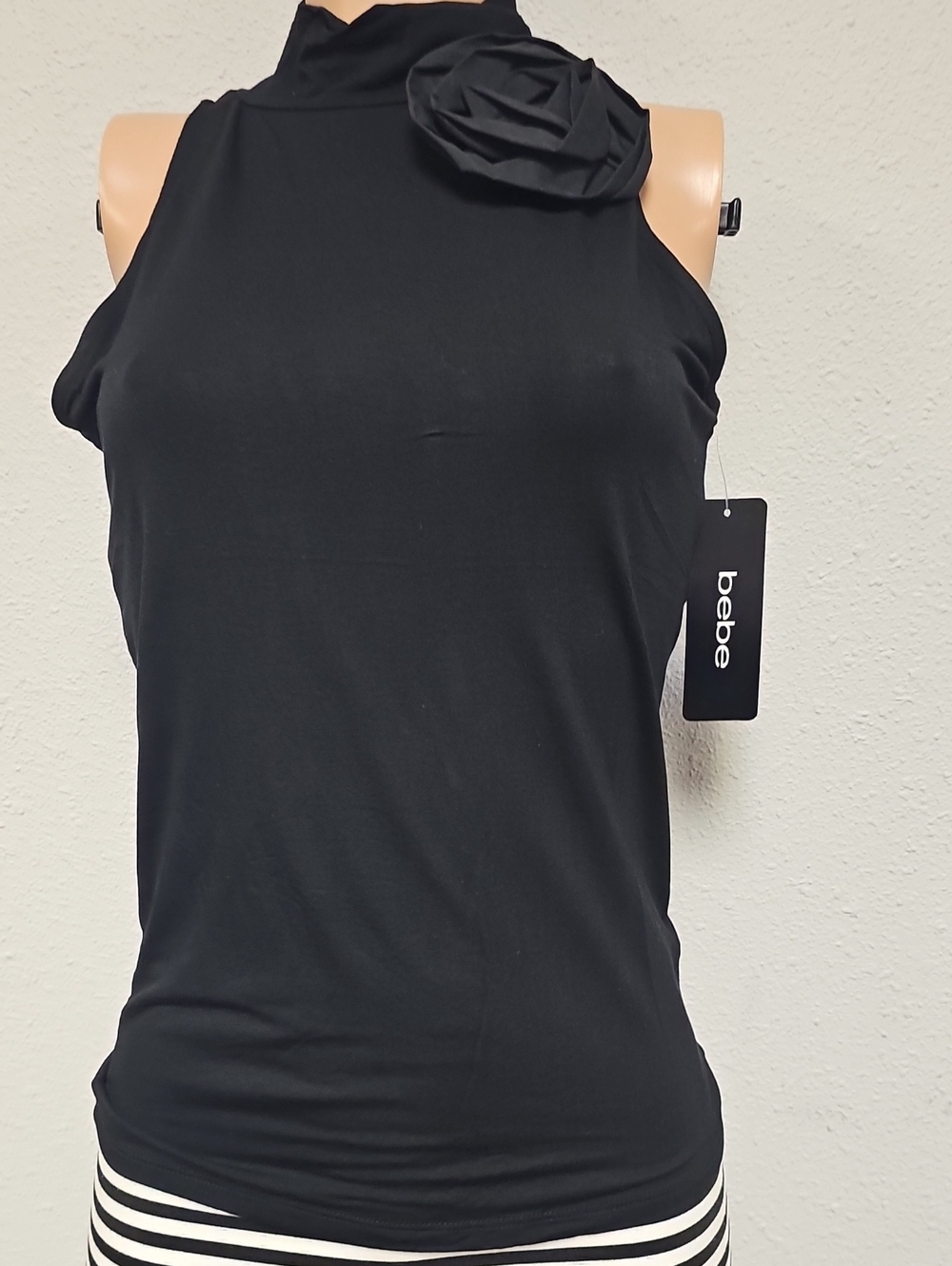 bebe Black Mock Neck Sleeveless Tank with Rosette